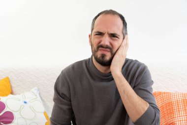 A man with ear ache.