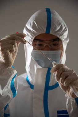 Medical personnel performing an antigen test for covid-19.