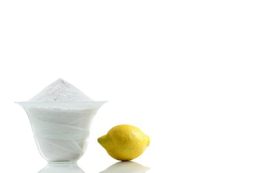 Household cleaning with baking soda and lemon isolated on white background.