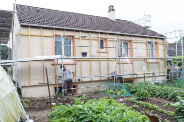 Wall insulation, scaffolding, carrying out aerial work, insulation of facades, mineral wool, composite panels cladding of buildings.