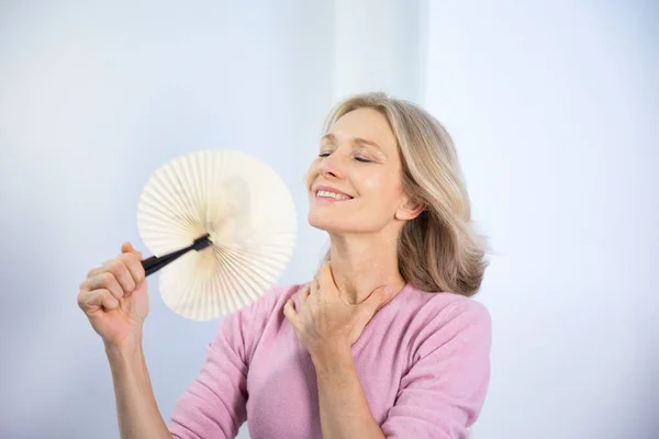 Menopausal Woman Having Hot Flush — Stockfoto