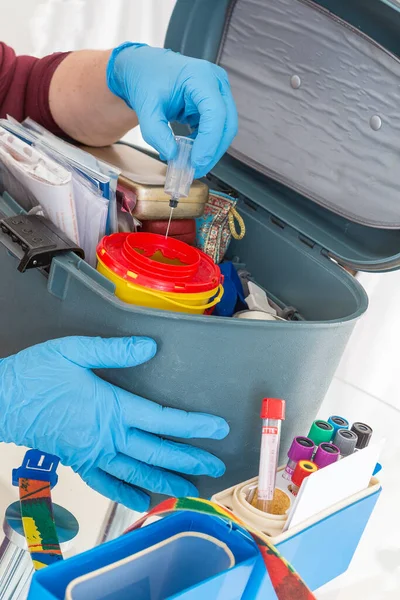 Nurse Organising Her First Aid Briefcase Medical Tools Assistance Equipment — Stock Photo, Image