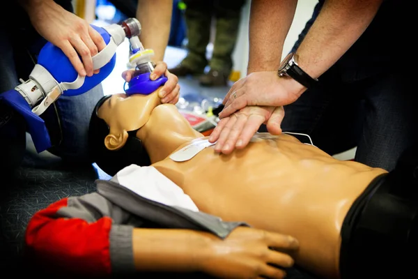 First aid training: alternate use of a manual resuscitator bag followed by cardiac massage.