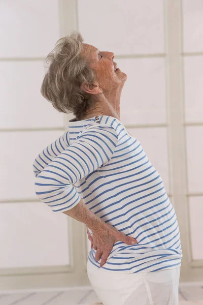 Senior Woman Suffering Lumbar Pain — Stockfoto