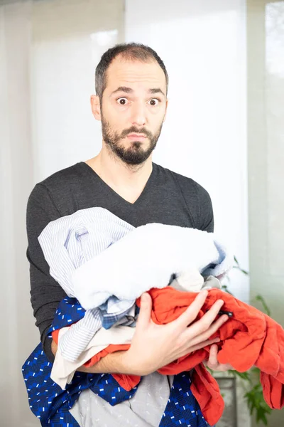 Man Terrified Ironing Sorting Washing — Stockfoto