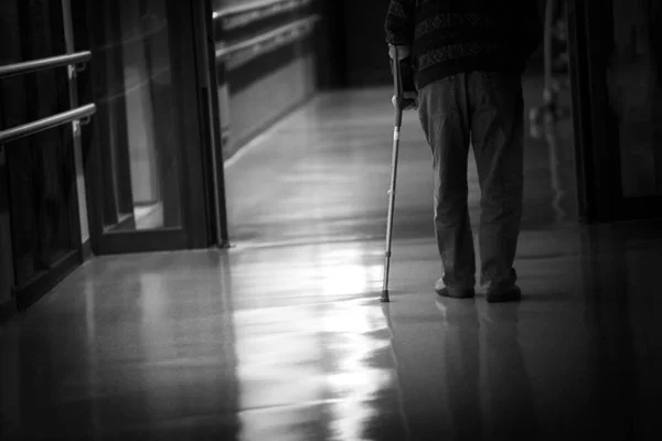 Man Cane Walking Hallway Retirement Home — Stockfoto