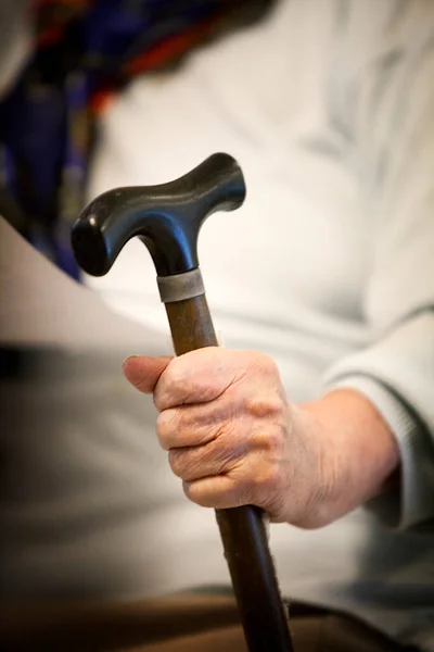 Elderly Woman Sits Her Cane Retirement Home —  Fotos de Stock