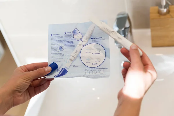 Woman Reading Instructions Pregnancy Test — Stock Photo, Image