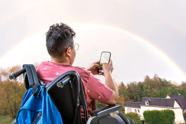 Teenager Wheelchair Facing Rainbow — Foto Stock