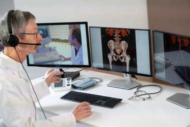 Cardiologist during a video consultation with a colleague for a phlebitis diagnosis.