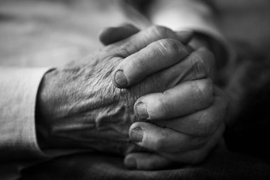 Close-up of the hands of an elderly man.