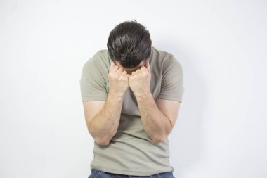 Depressed man on studio background