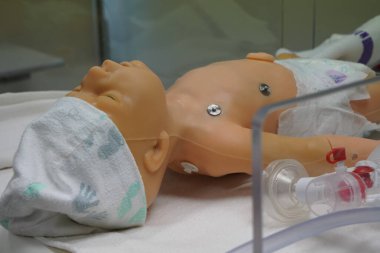 New born mannequin during a pediatric resuscitation simulation workshop.