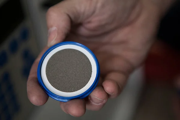 Air quality analyzes: metal filter, the white border indicates the color of the filter before use.