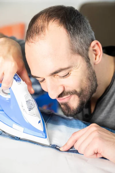 Man Carefully Ironing His Shirt — Fotografia de Stock