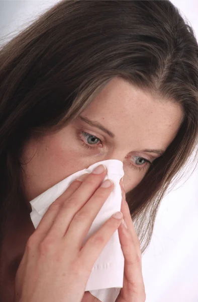 young woman with runny nose