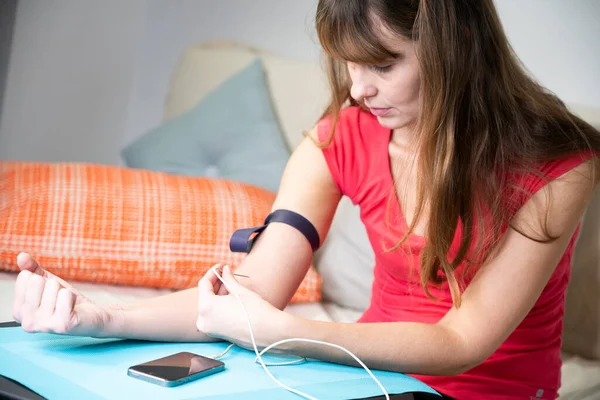 Woman Giving Herself Injection Her Arm Smartphone — 스톡 사진