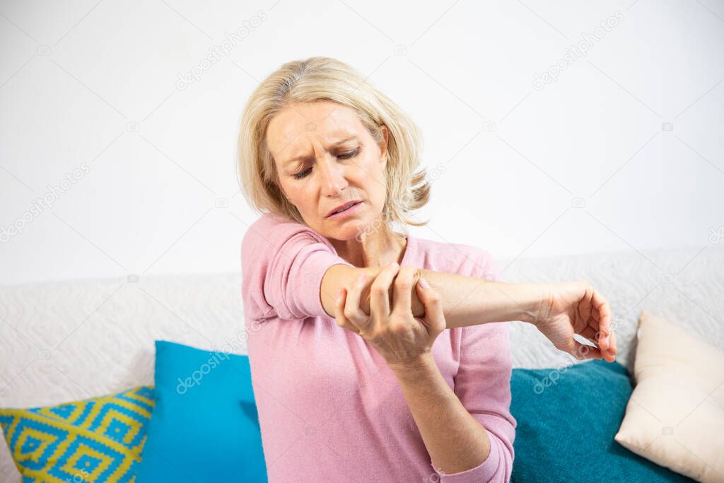 A woman in her fifties with elbow pain.
