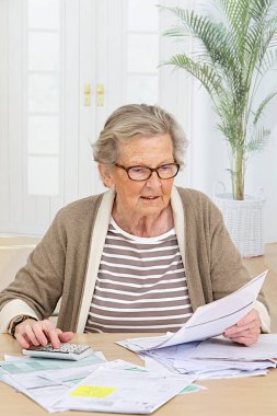 Senior woman doing paperwork.