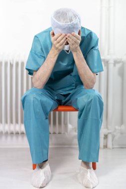 A surgeon exhausted by his work.