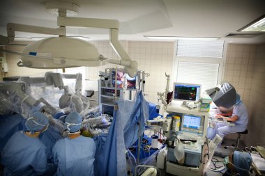 Surgeon performing a prostatectomy, removal of the prostate, using a robot surgeon.
