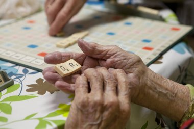 Elderly person playing in a retirement home.