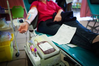 Blood donor in a blood collection facility.
