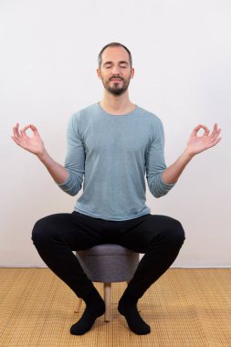 A man carrying out relaxation techniques.