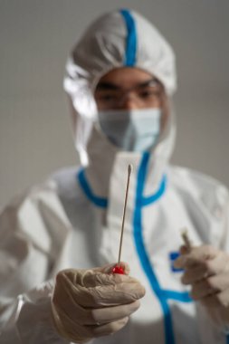 Medical personnel performing an antigen test for covid-19.