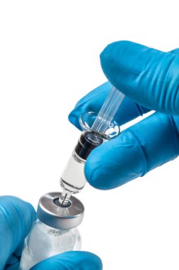 Close up of preparing and filling a vaccine into a syringe.