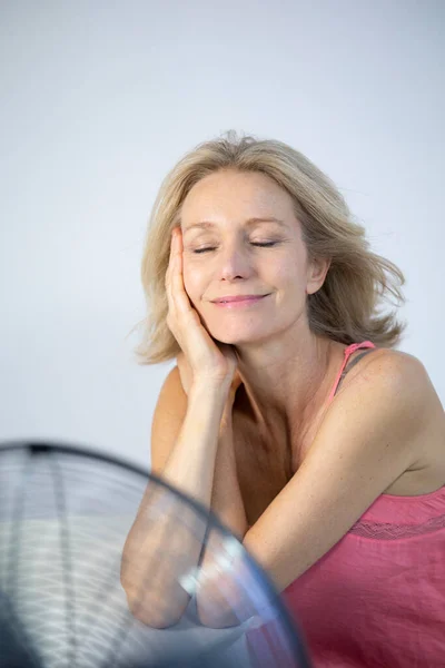 Menopausal Woman Having Hot Flush — Stockfoto