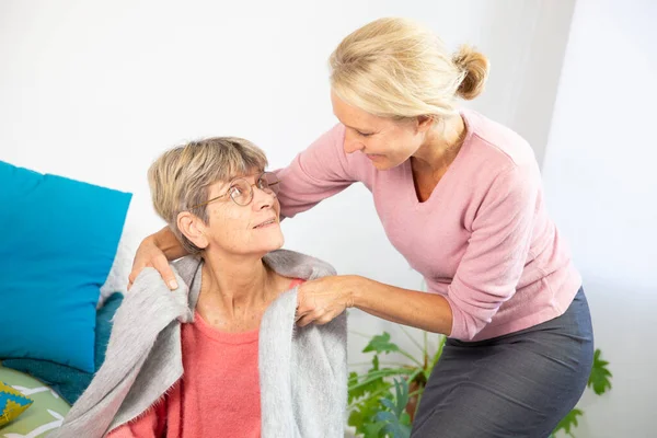 Woman Her Fifties Putting Shawl Elderly Woman — Stockfoto