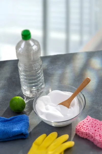 Baking soda, lemon with sponge and towel for effective and safe house cleaning