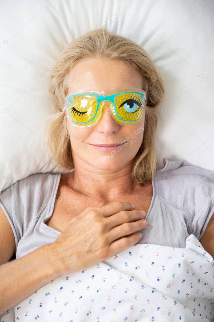 Woman wearing a sleep mask.