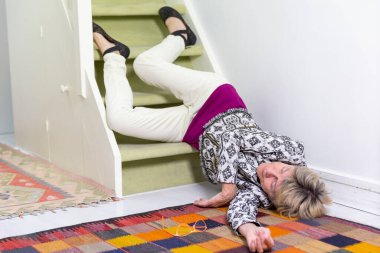 Elderly woman who has fallen down stairs.