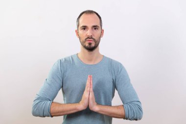 A man carrying out relaxation techniques.