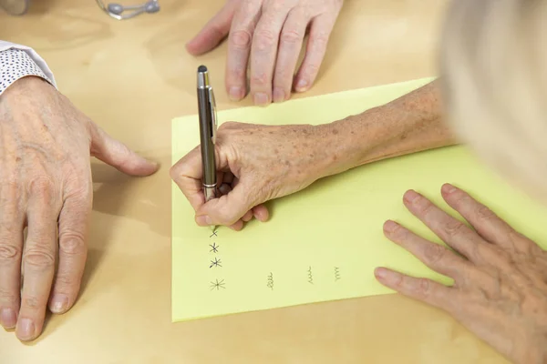 Physician Doing Writing Rehabilitation Woman Parkinson Disease — Zdjęcie stockowe