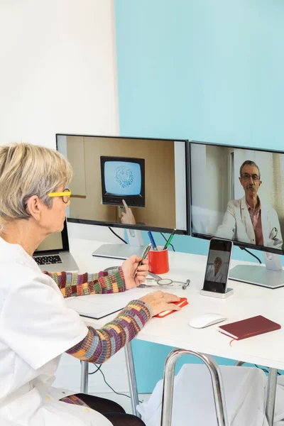 Teleconsultation Two Doctors Stem Cell One Screens — Stockfoto