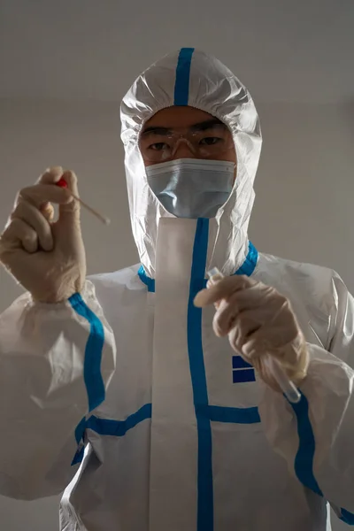 Medical personnel performing an antigen test for covid-19.