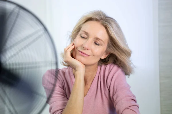 Menopausal Woman Having Hot Flush — Stockfoto