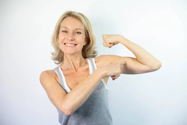 Woman Looking Her Muscles — Stock Photo, Image