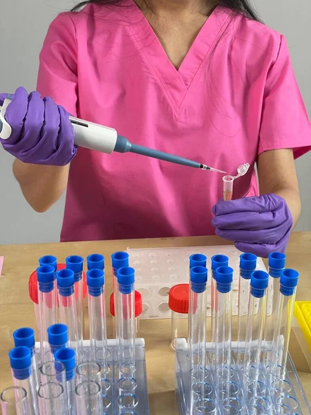 Woman Injecting Substance Tube Using Pipette — Stockfoto