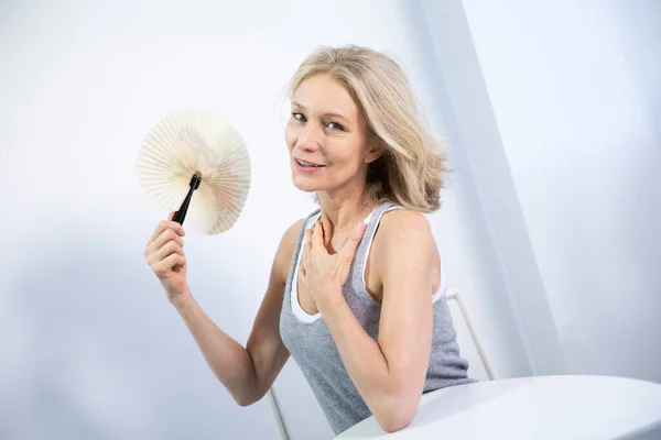 Menopausal Woman Having Hot Flush — Stockfoto