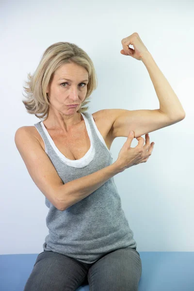Woman Looking Her Muscles — Photo