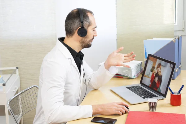 Hospital Doctor Video Consultation Wearing His White Coat — Photo