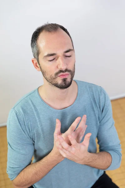 Man Carrying Out Relaxation Techniques — Photo