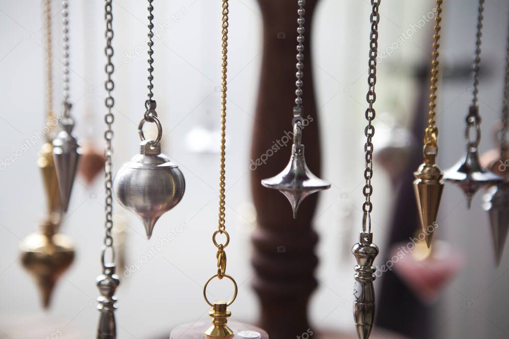 Pendulums being used for the exercise of the trade of healer dowser and magnetizer.