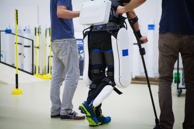 Exoskeleton for the rehabilitation and training of a paraplegic. clipart
