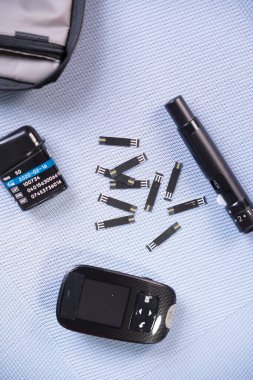 Close-up of a diabetic blood glucose measurement kit.