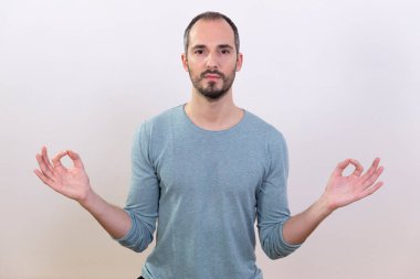 A man carrying out relaxation techniques.